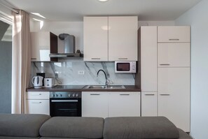 Apartment (A3) | Private kitchen | Fridge, oven, stovetop, espresso maker - Apartments Villa Summertime (Tisno)