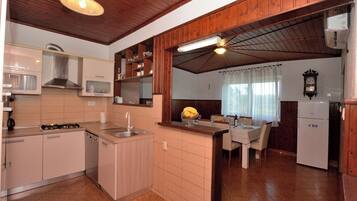 Villa | Private kitchen | Fridge, microwave, oven, stovetop