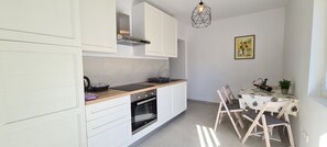 Apartment (A1) | Private kitchen | Fridge, oven, stovetop, dishwasher - Apartments Pleasures (Jelsa)