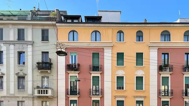 A row of multi-story buildings with balconies and arched windows. - Botanical modernist home | Milanese living (Milano)