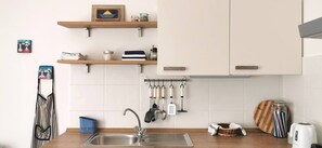 Apartment (A1) | Private kitchen | Fridge, oven, stovetop, espresso maker - Apartments Marinic (Novalja)