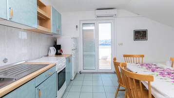 Apartment (A4) | Private kitchen | Fridge, oven, stovetop, espresso maker