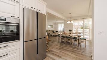 Villa | Private kitchen | Fridge, microwave, oven, stovetop