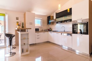 Apartment (A1) | Private kitchen | Fridge, microwave, oven, stovetop - Apartment Hilda (Solin)