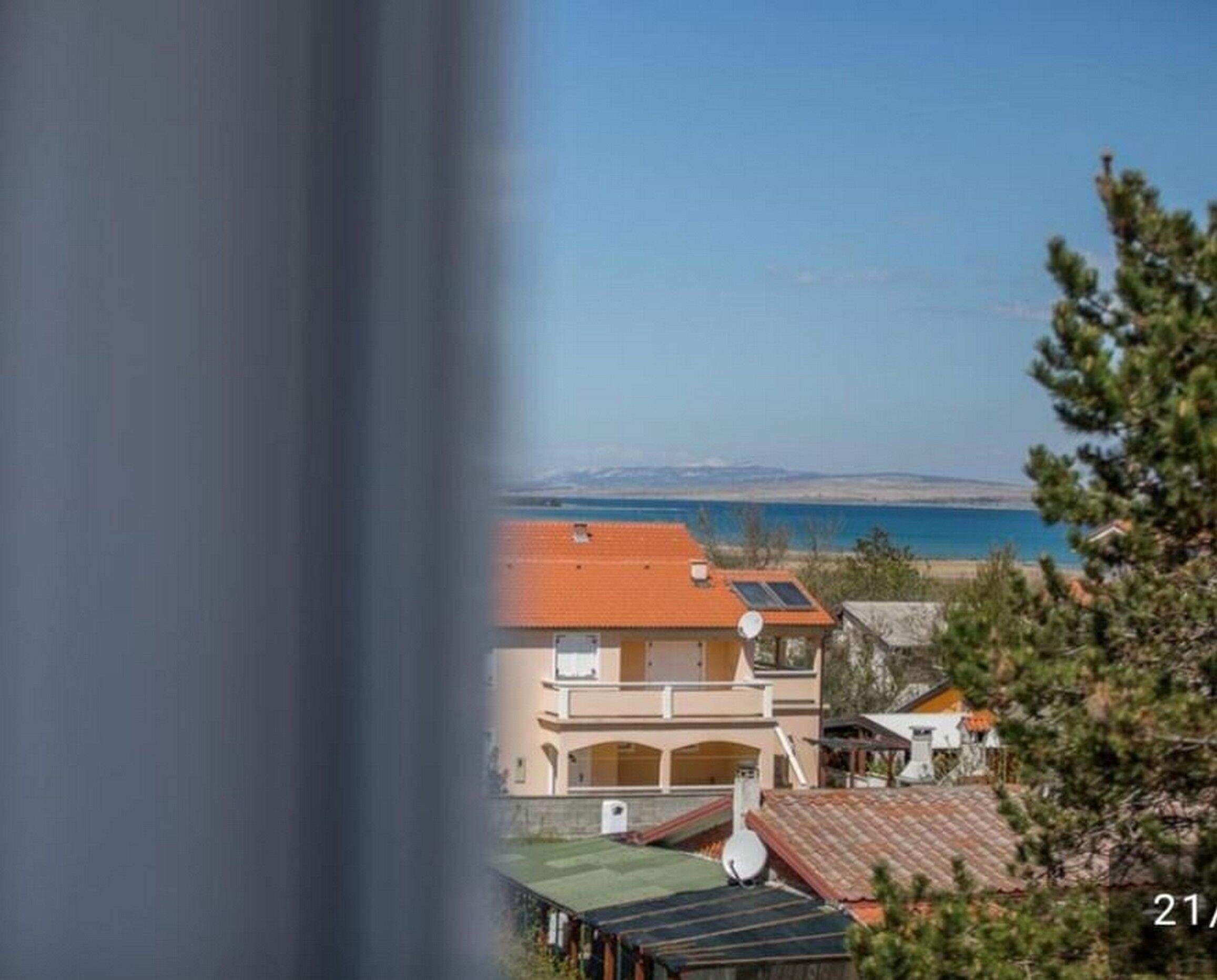 A coastal residential area with a view of the sea.