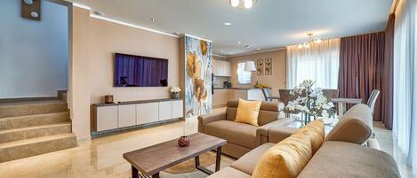 Villa | Salle de séjour | Foyer, lecteur de DVD