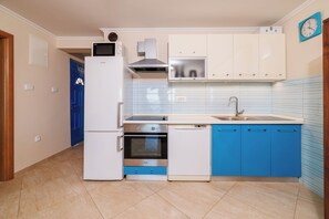 Apartment (A1) | Private kitchen | Fridge, microwave, oven, stovetop - Apartment Marijana (Novi Vinodolski)