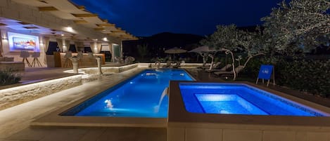 Outdoor pool, a heated pool, pool umbrellas