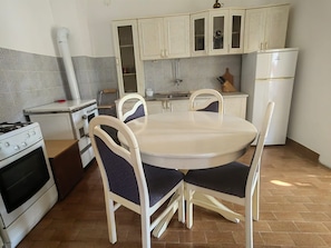 Apartment (A2) | Private kitchen | Fridge, microwave, oven, stovetop - Apartments Green Oasis (Novi Vinodolski)