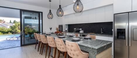 Villa | Private kitchen | Fridge, oven, stovetop, dishwasher