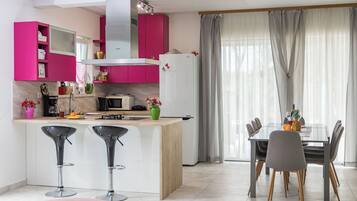 Villa | Private kitchen | Fridge, microwave, oven, stovetop