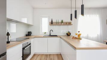 Villa | Private kitchen | Fridge, microwave, oven, stovetop