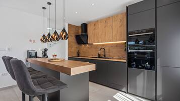 Villa | Private kitchen | Fridge, microwave, oven, stovetop