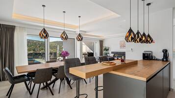 Villa | Private kitchen | Fridge, microwave, oven, stovetop