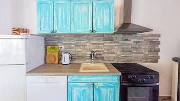 Villa | Private kitchen | Fridge, microwave, oven, stovetop