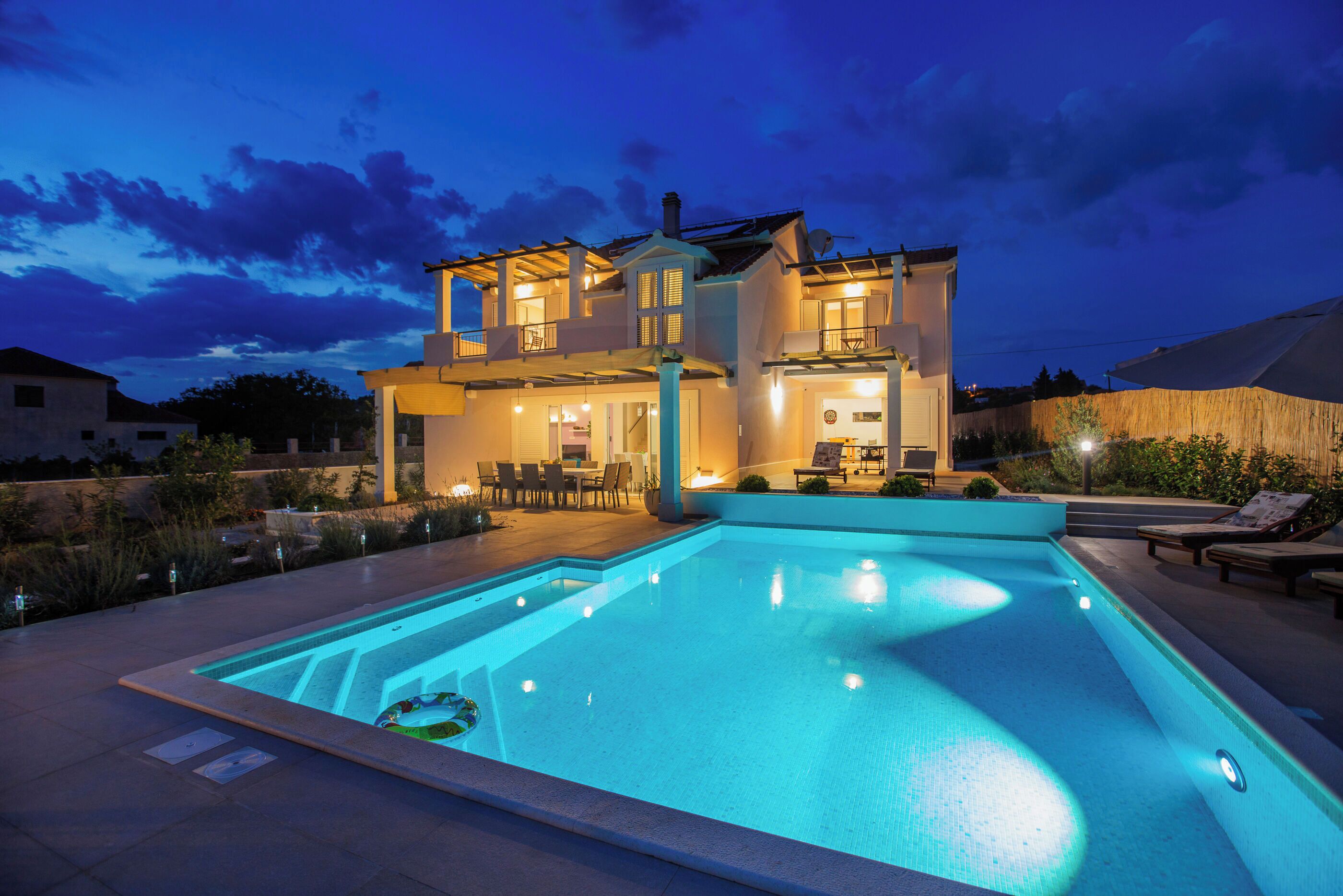 Outdoor pool, a heated pool, open open 24 hours, pool umbrellas