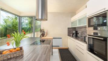 Villa | Private kitchen | Fridge, microwave, oven, stovetop