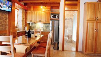 Villa | Private kitchen | Fridge, microwave, oven, stovetop