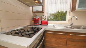 Villa | Private kitchen | Fridge, microwave, oven, stovetop