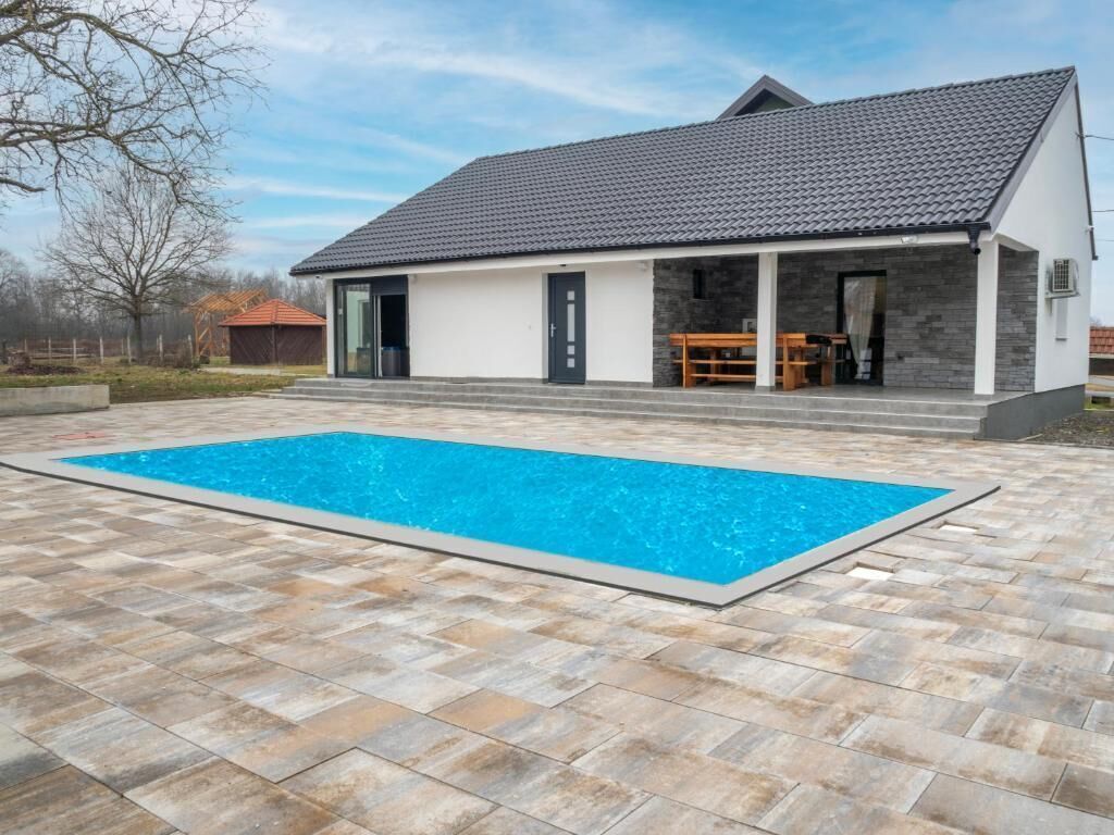 Outdoor pool, a heated pool, sun loungers