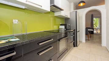 Villa | Private kitchen | Fridge, microwave, oven, stovetop