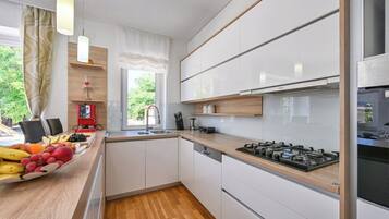 Villa | Private kitchen | Fridge, microwave, oven, stovetop