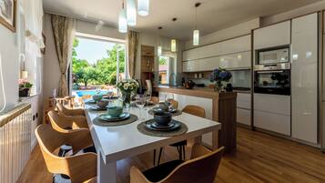 Villa | Private kitchen | Fridge, microwave, oven, stovetop