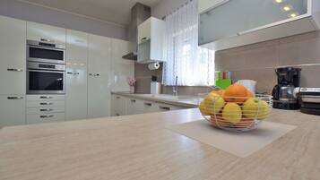 Villa | Private kitchen | Fridge, microwave, oven, stovetop