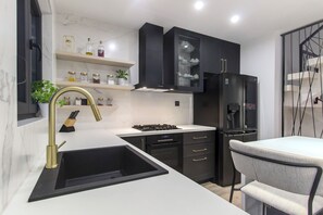Villa | Private kitchen | Fridge, microwave, oven, stovetop
