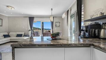 Villa | Private kitchen | Fridge, microwave, oven, stovetop