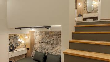 Phòng Suite Deluxe, không hút thuốc, quang cảnh sân vườn | Khu phòng khách