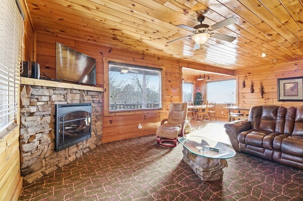 Signature Cabin, 4 Bedrooms, Hot Tub, Mountainside | Living room | 45-inch Smart TV with digital channels - Just For Fun (Sevierville)