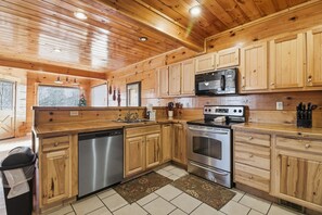 Signature Cabin, 4 Bedrooms, Hot Tub, Mountainside | Private kitchen | Fridge, microwave, oven, stovetop - Just For Fun (Sevierville)