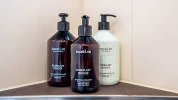 Three bottles of Jean & Len products on a shelf.
