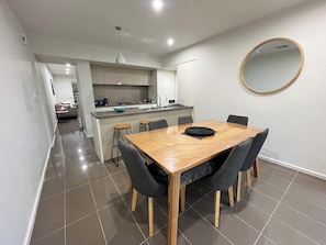 A modern kitchen with a dining area. - Tasha's Apartment in St Clair (Saint Clair)