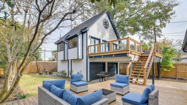 A house with a deck, outdoor seating, and a covered area. - 1 Mi to Rice! Pet-friendly, Modern Apt in Houston (Houston)