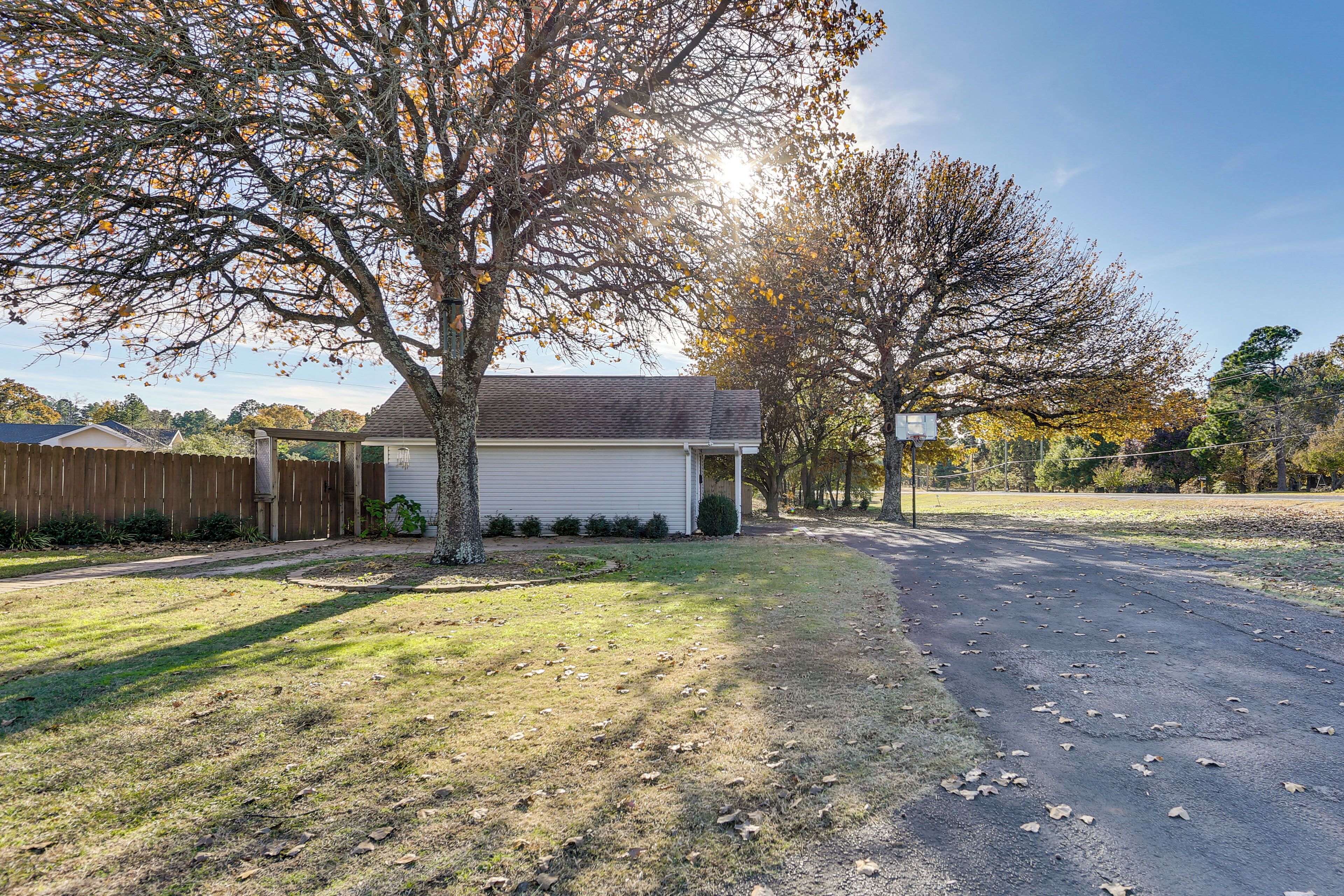 A residential property with a garage, a lawn, and a driveway.