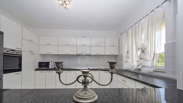 Villa | Private kitchen | Fridge, microwave, oven, stovetop