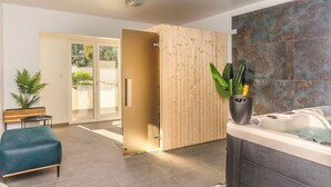 A modern bathroom with a hot tub, wooden paneling, and a bench. - Villa Julija (Vodice)