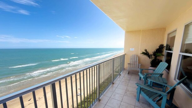 A balcony with a view of the beach and ocean. - Penthouse Beachfront Views Renovated 4 Bedroom Condo (South Padre Island)