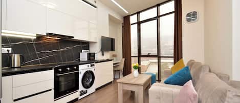 Appart'hôtel, vue ville | Coin séjour