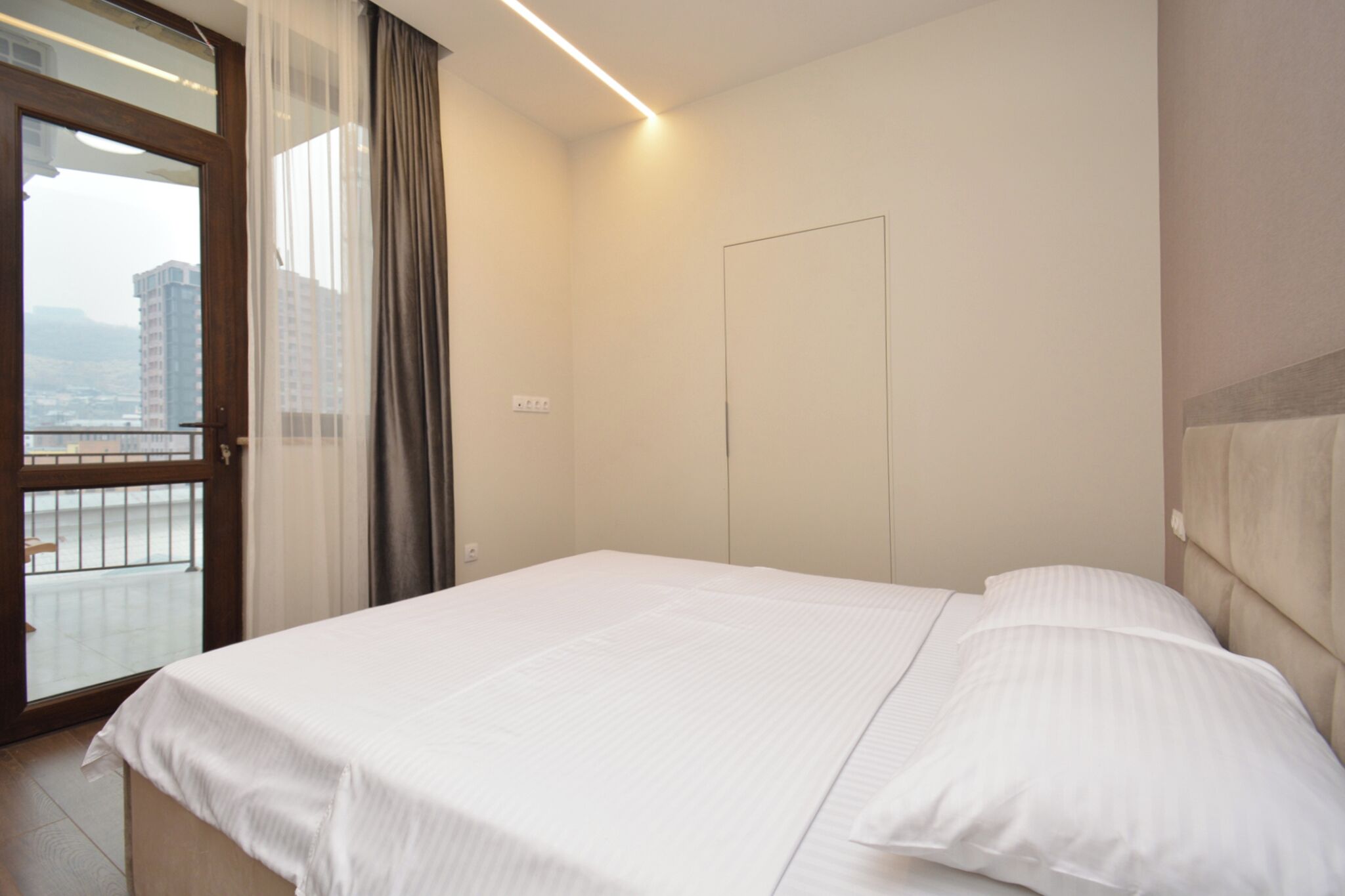 Condo, City View | Blackout drapes, iron/ironing board, free WiFi