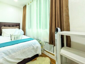Iron/ironing board, free WiFi, bed sheets, wheelchair access - Cozy 2-bedroom 2-bathroom condo with AC near Everything in enjoyable Mandaluyong (Mandaluyong)