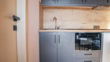 Fridge, microwave, stovetop, cookware/dishes/utensils