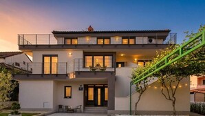 A modern two-story house with a balcony, a staircase, and a paved driveway. - Cocaletto Villa / Bohemia Apartment 6 (Rovinj)