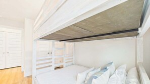 A bedroom with a bunk bed, white walls, and a wooden ceiling. - Palmeras Place 170-Townhouse-Sleeps 10 (Panama City Beach)