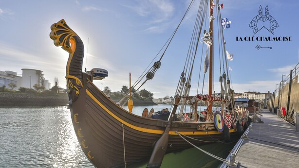 A Viking ship docked at a pier with a logo in the top right corner. - Capitainerie – Marina des Sables d’Olonne (Les Sables-d´Olonne)