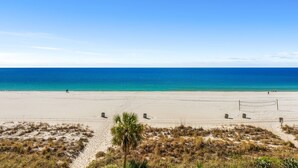 A beach with a volleyball net, sand, and a clear blue sky. - Incredible Gulf Views from Every Room | 2BR/2BA | Sleeps 6. Under new management! (Panama City Beach)