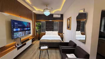 Family Apartment, Balcony, City View | In-room safe, desk, laptop workspace, blackout drapes