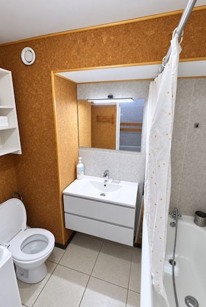 A bathroom with a toilet, sink, mirror, and shower. - Val Thorens - Ski In/Out - 6 Beds Flat (N-194) (Les Belleville)